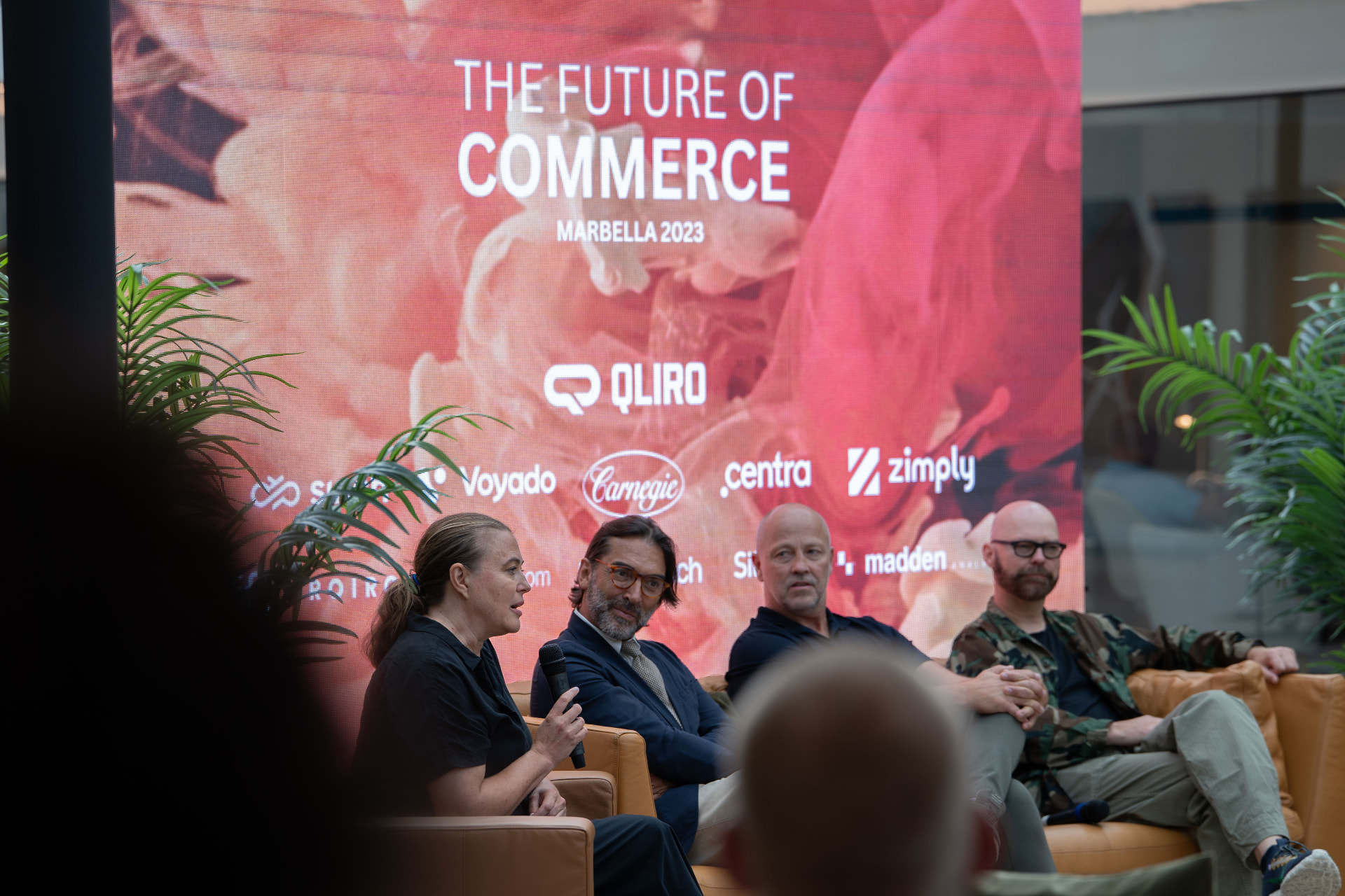 A panel conversation on stage at a previous Marbella gathering