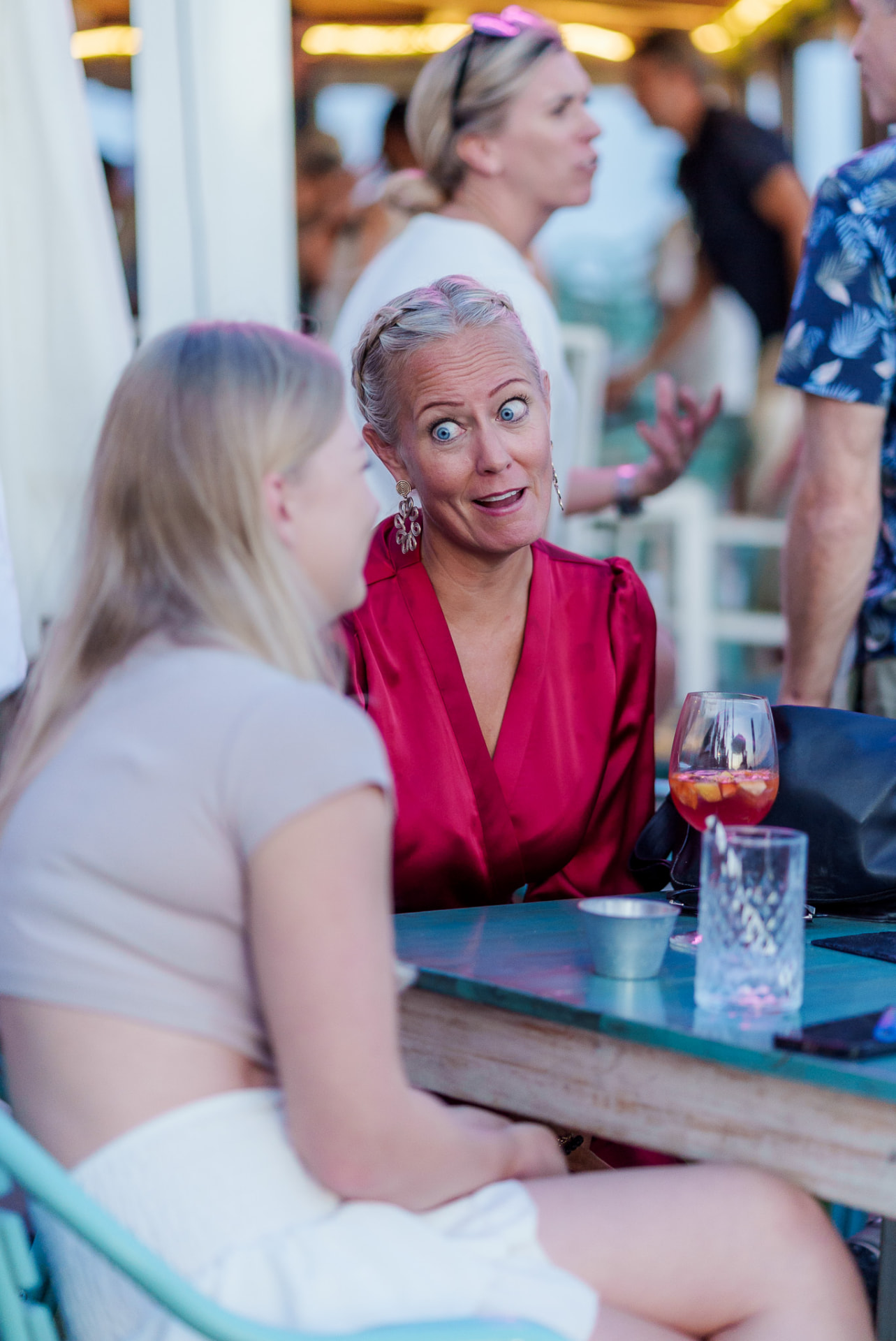 Guests sharing a conversation on a terrace