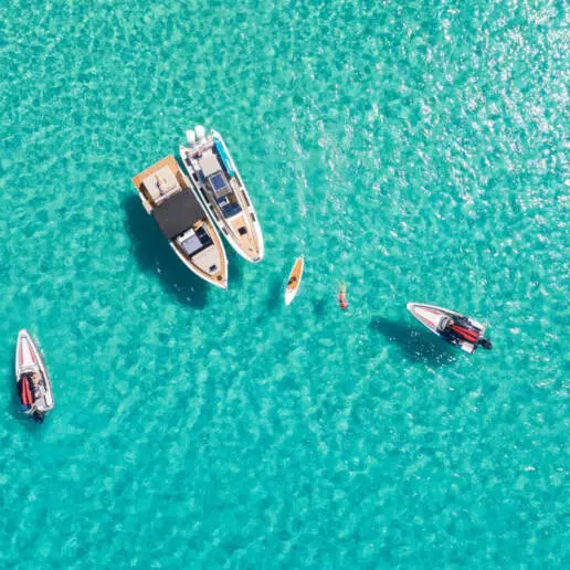 Boats anchored in turquoise water